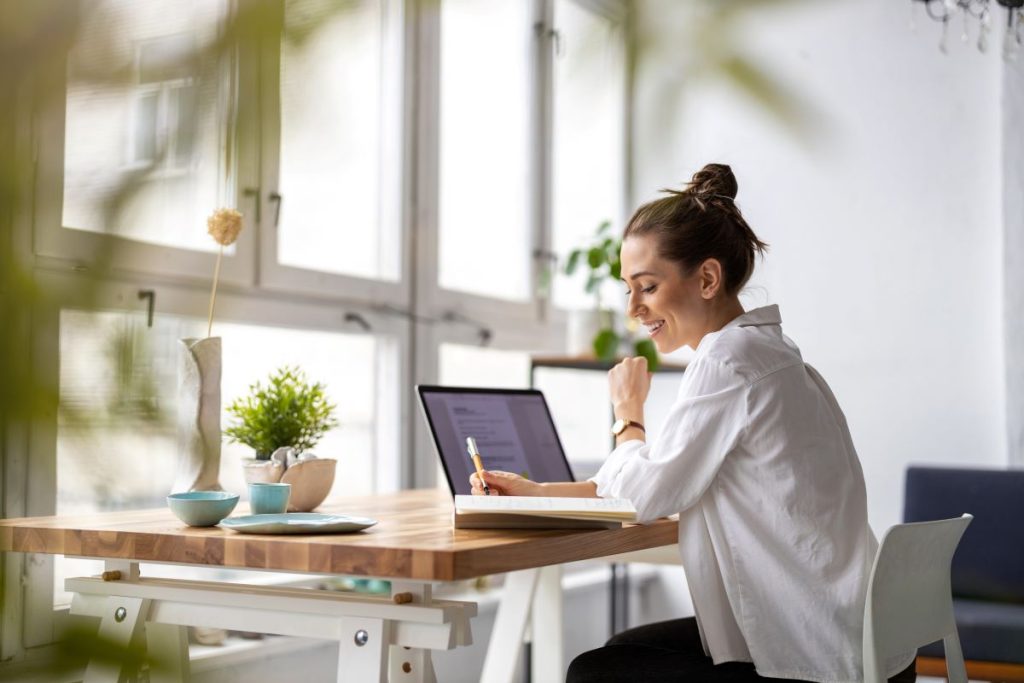 Woman on computer realising concessional contributions will boost her super