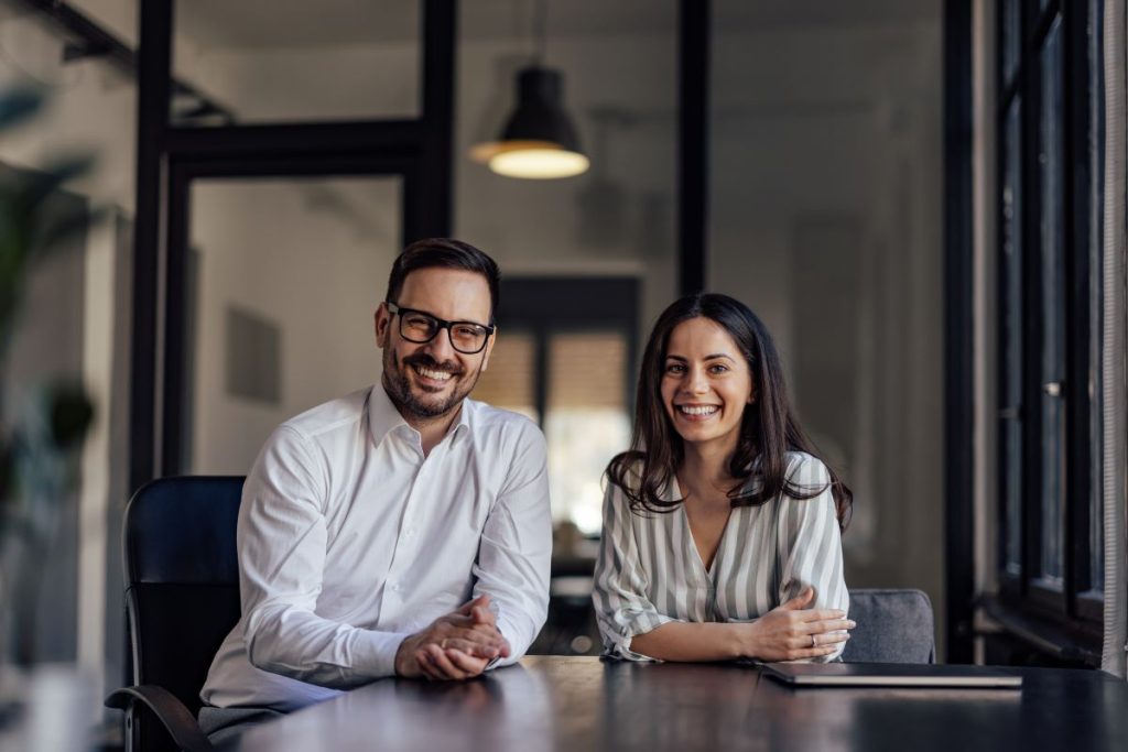 Two small business owners happy to have buy sell agreement in place to protect them and the business