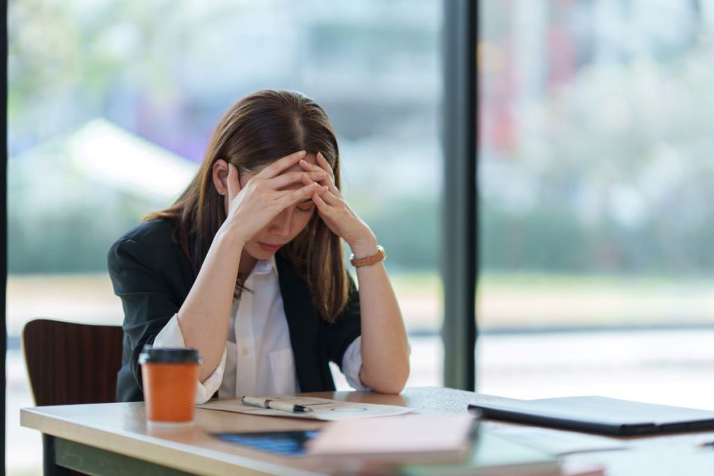 Woman who has just learned she has been made redundant