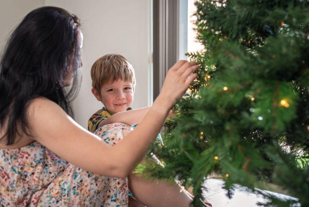 Happy family having saved money with our top christmas shopping hacks
