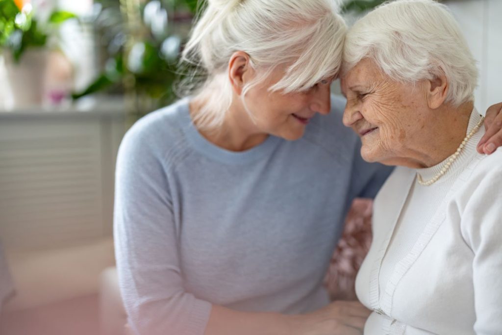 Daughter helping elderly mother navigate aged care