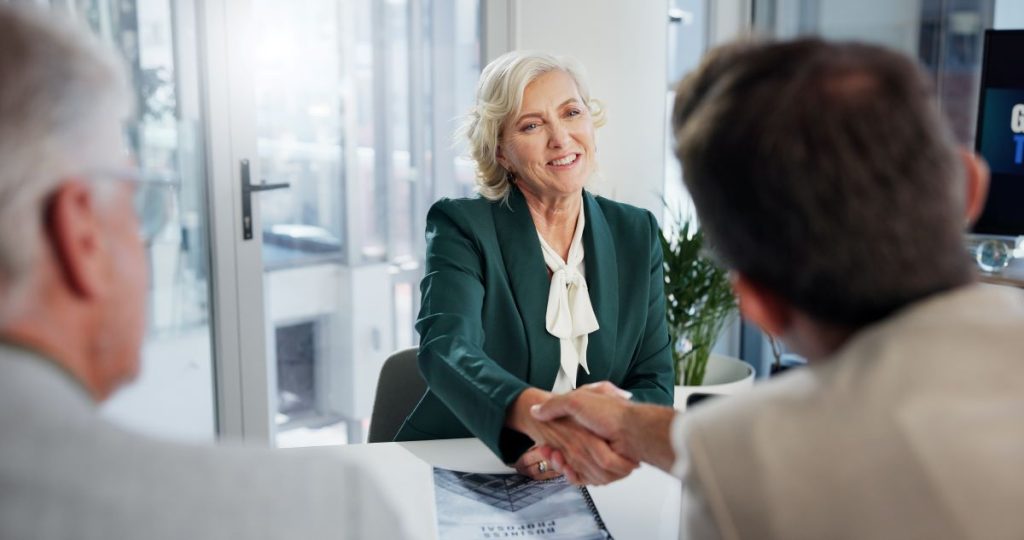 Man speaking with financial adviser and lawyer