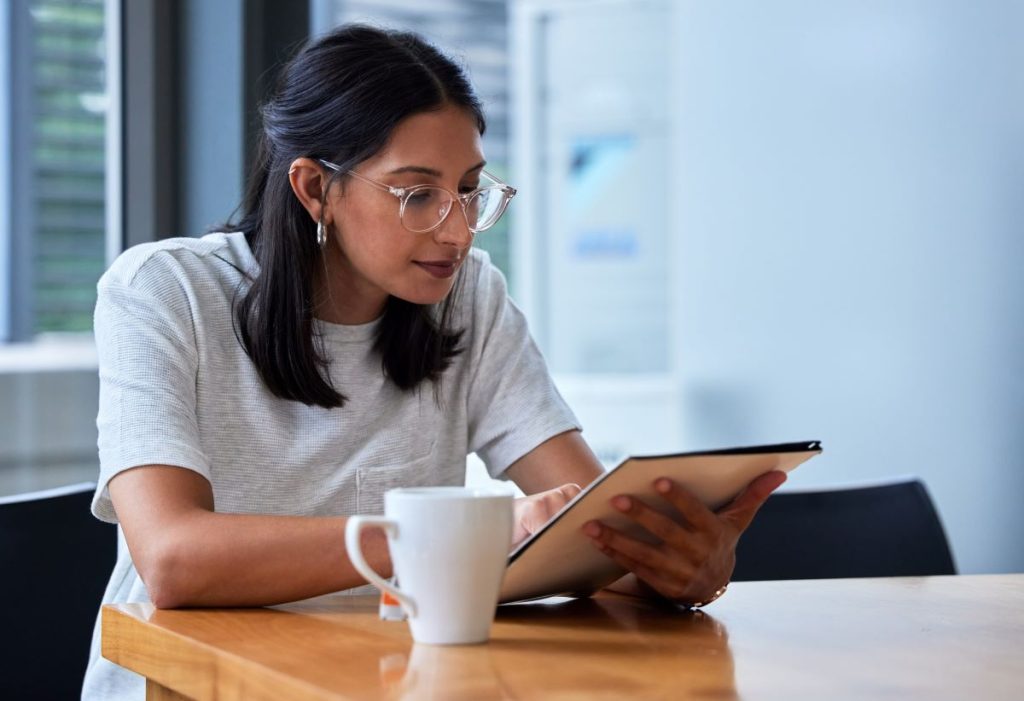 Employee reading up on payday super changes and what it means for her super savings